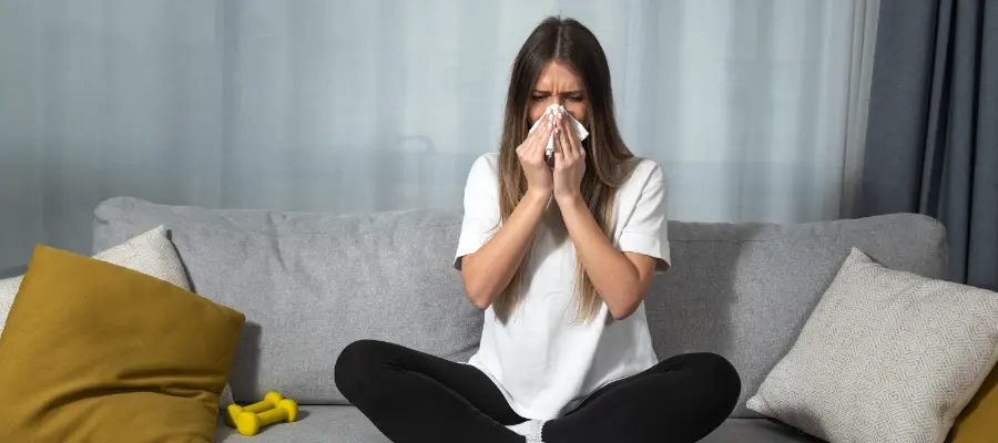 A young woman suffering from allergies.
